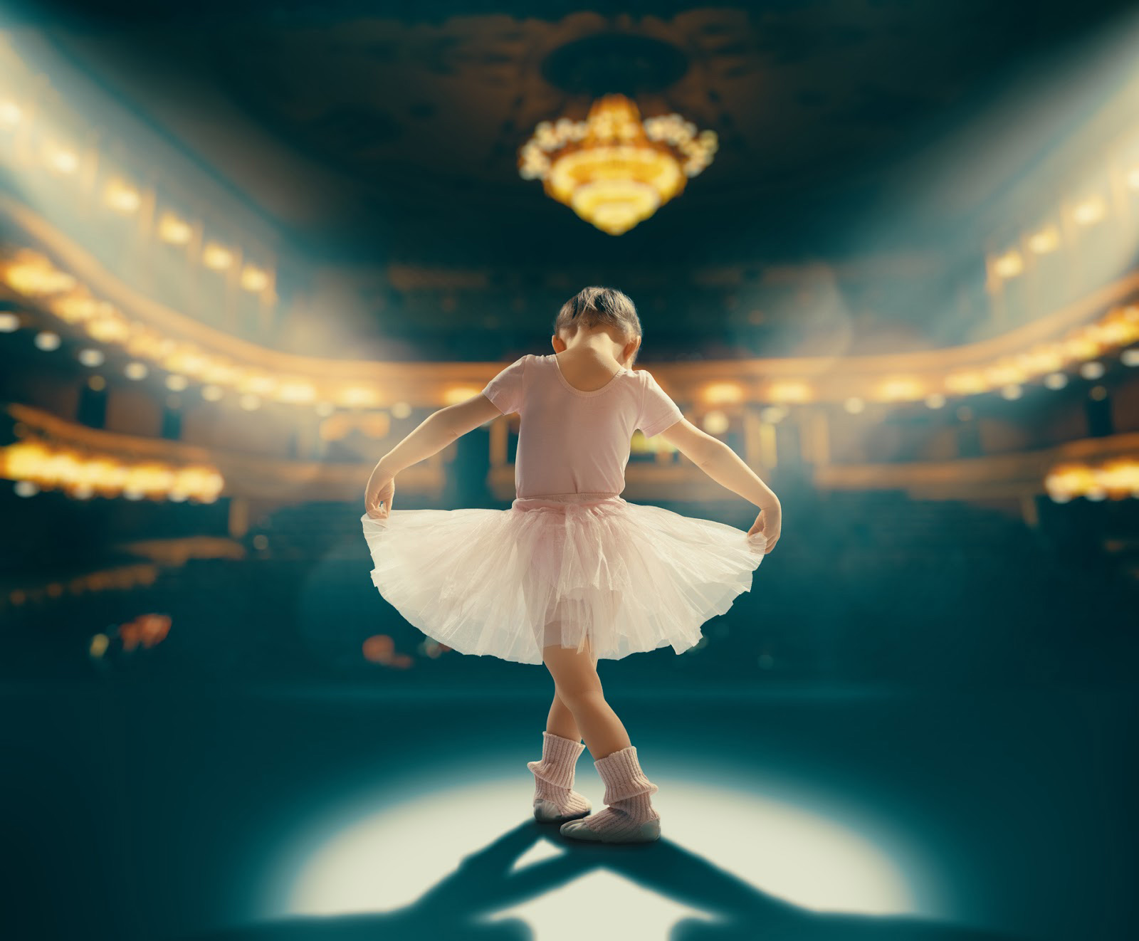 Cute little girl dreaming of becoming a ballerina